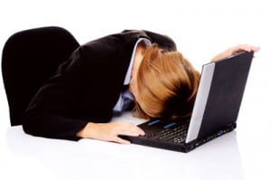 Frustrated business woman with laptop