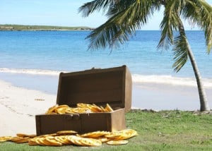 Open treasure chest on a desert island 