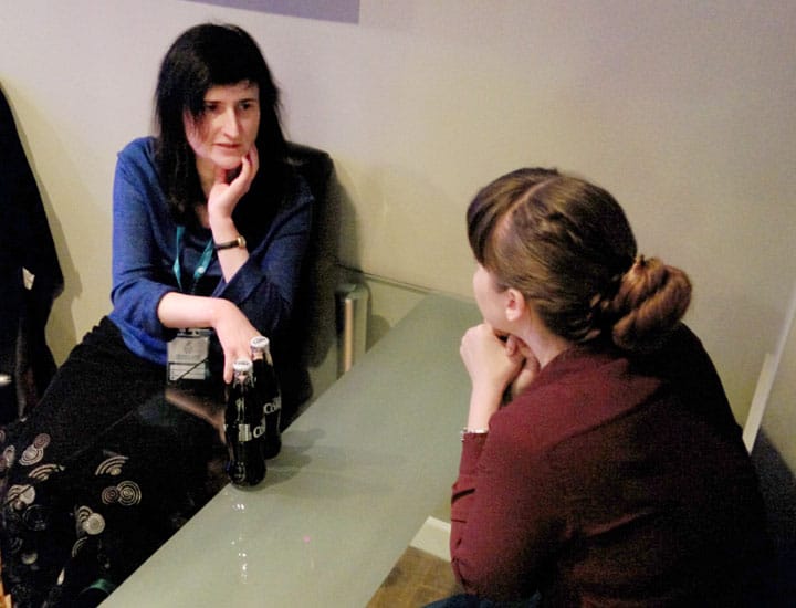 Claire talking to Chelsea Haden at the Saturday social, Photo by Gary Jones.