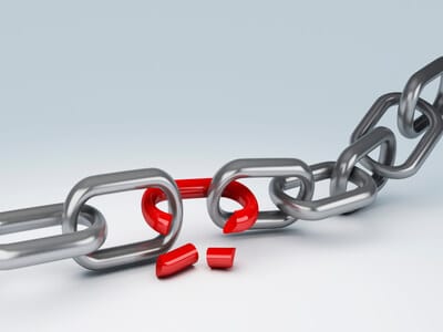 A metal chain with a broken red link