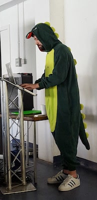 Michiel Bijl in a dinosaur outfit