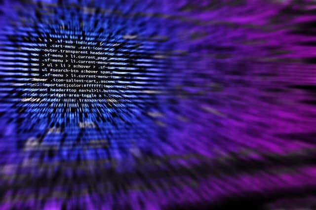 Blurred image of code representing hacking