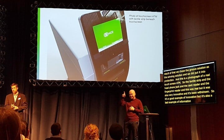 Phil Day with a slide of the touchscreen ATM with tactile strip